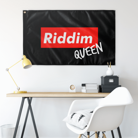 Riddim Queen black rave flag hung above a desk in a bedroom setup