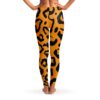 Back view of orange and black tiger stripe rave leggings with bold all-over stripes