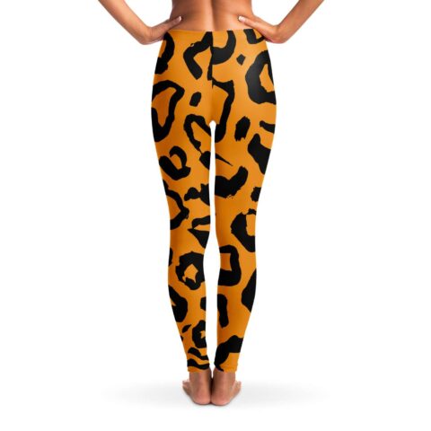 Back view of orange and black tiger stripe rave leggings with bold all-over stripes