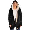 woman modeling open black halftone dot cloak with cream fleece lining