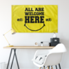 Yellow EDC smiley flag hung above a desk setup in a bright home office