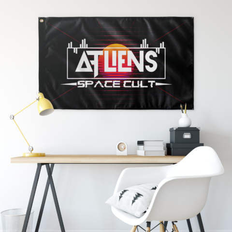 ATLiens Space Cult flag hung on wall above desk in festival-themed room setup