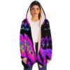 Woman modeling black rave cloak with neon holographic oil slick print and fuzzy hood