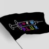 Close-up of flag rippling in wind showing syringe design with P.L.U.R lettering and star accents