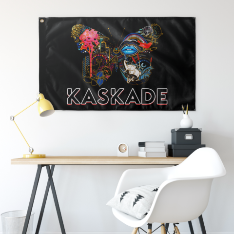 Kaskade butterfly collage flag hung on wall above desk with yellow lamp and white chair