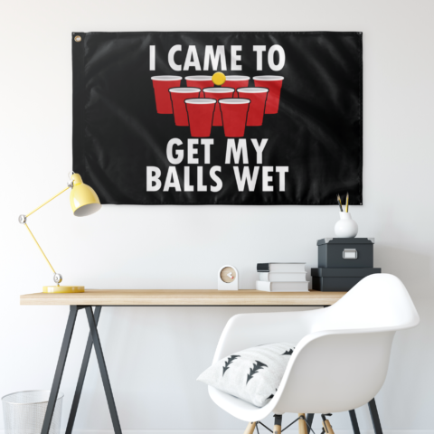 Beer pong themed flag hung above a desk showing red cups and bold white text