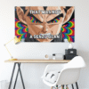 Anime-inspired rave flag with rainbow fractal design hung above a desk with lamp and chair