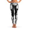 Black and white tie-dye rave leggings with swirl pattern, front view