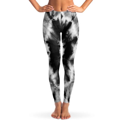 Black and white tie-dye rave leggings with swirl pattern, front view