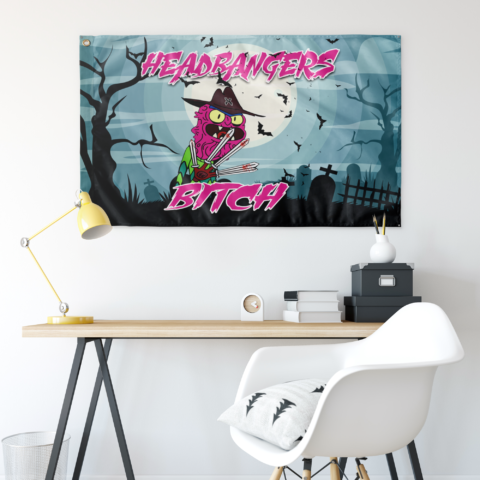 Pale teal zombie rave flag hung above desk with graveyard and bat print