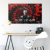 Black red menacing figure rave flag hung above a desk with pentagram corner accents