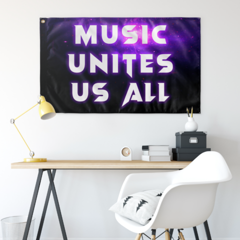 Galaxy rave flag hung on wall above desk with yellow lamp and white chair