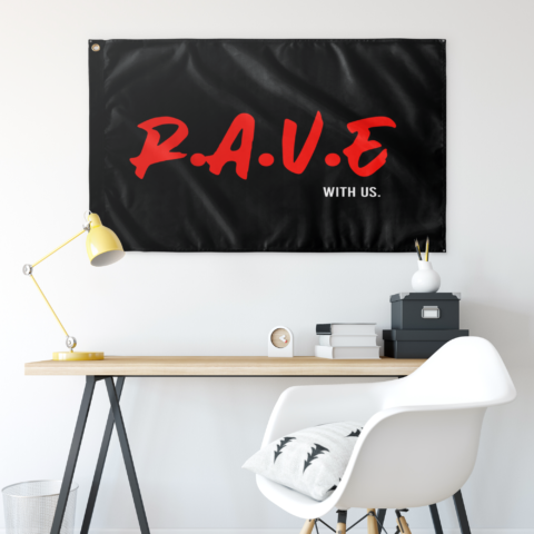 Black R.A.V.E. flag with With Us. text hung above a desk in a room setting