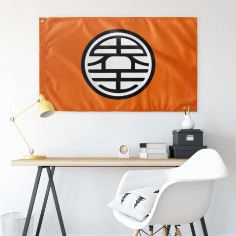 Orange circular kanji flag hung above a desk in a minimalist room setting