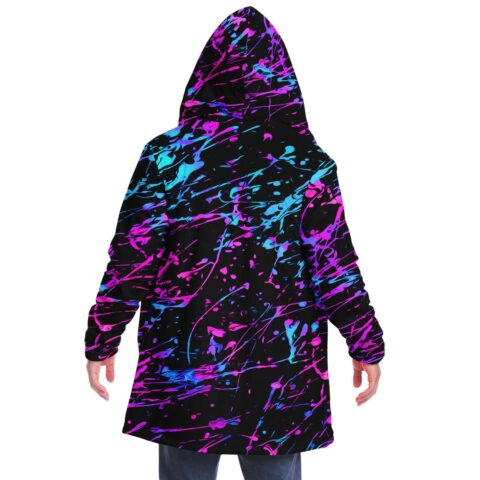 Neon splatter rave cloak back view on model, hood up, black pink cyan paint splash