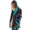 Man wearing black swirling liquid rave cloak with cream fleece lining, side angle