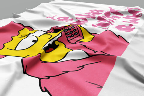 Close-up of flag fabric showing yellow cartoon face on phone, dripping pink lettering in background