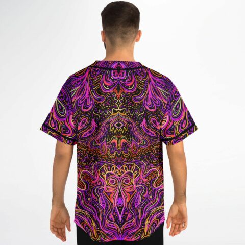 Man wearing magenta psychedelic rave baseball jersey showing mirrored swirl pattern on back