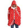 Front view of model wearing red monogram print hooded cloak with cream sherpa lined hood
