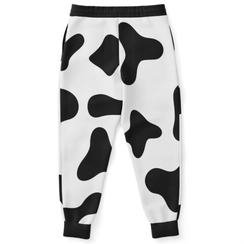 Cow print rave joggers back view showing black cuffs and scattered spot pattern