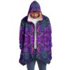 Front view of man wearing open psychedelic mandala print hooded rave cloak with sherpa lining