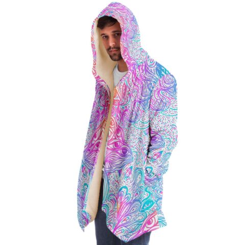 Man wearing white ornate psychedelic rave cloak with sherpa lined hood open front