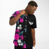 side view of man adjusting collar on pink floral split rave jersey