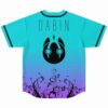 Turquoise rave jersey back view with DABIN text and black creature emblem over floral vines