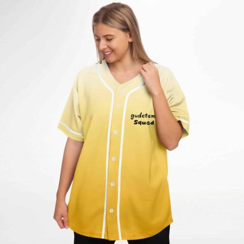 Woman wearing yellow ombre baseball jersey with gudetama squad text on chest