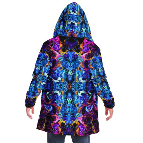 Model wears deep blue symmetrical fluid rave cloak with hood up, back view
