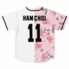 Soft pink cherry blossom split rave baseball jersey with custom name and number over the floral panel, back view