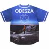 Back view of blue rave jersey with bold festival-themed lettering over twilight beach scene