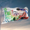 Cartoon dog rave flag flying on pole against sunset sky showing tie-dye lettering