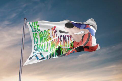 Cartoon dog rave flag flying on pole against sunset sky showing tie-dye lettering