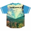 Back view showing surreal forest valley print with text Tame Impala across the shoulders