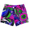 Back view of abstract psychedelic swim trunks showing green and pink flower burst design