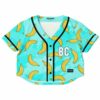 Front view of the banana leaf rave crop top on a teal background with BC lettering