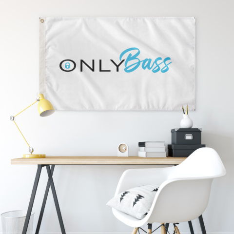 Only Bass wordmark flag mounted on wall above minimalist desk setup