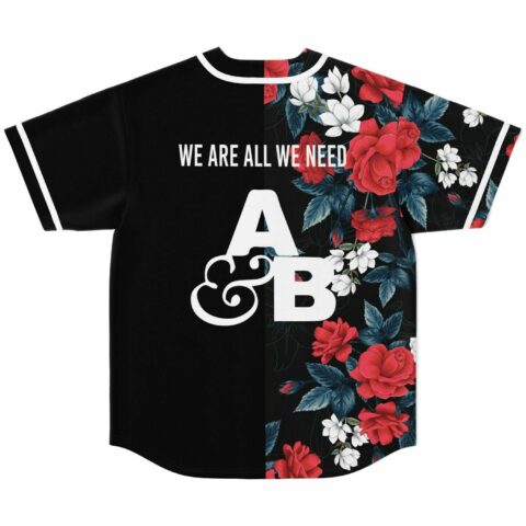 Dark floral back with split panels, “WE ARE ALL WE NEED” text and AB emblem