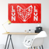 White stylized fox emblem and vertical LUN text on bright red flag, wall display
