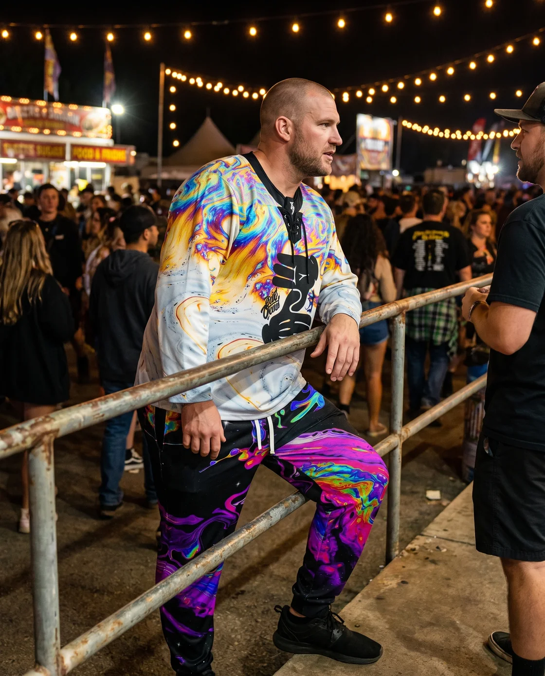 Man wearing a colorful hockey jersey with black joggers at night