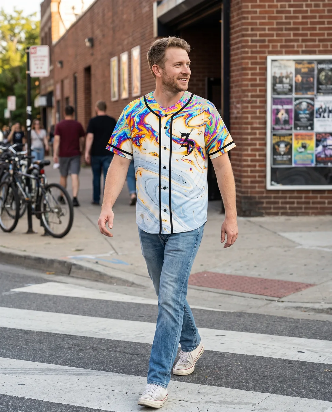 Man wearing a buttoned rave baseball jersey tucked into straight jeans
