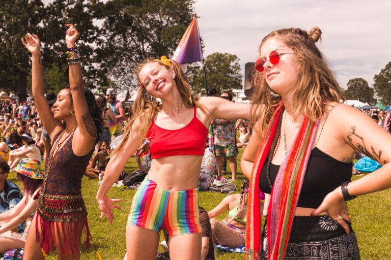 A group of women dancing at a music festival