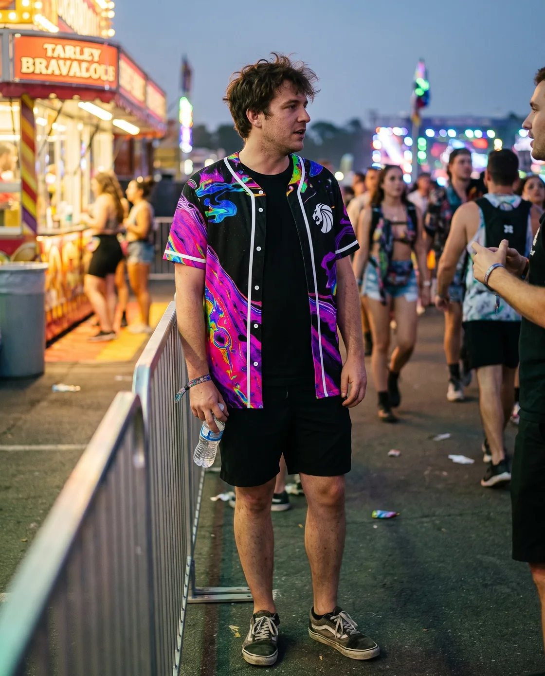Festivalgoer wearing a psychedelic baseball jersey over a tee at EDC