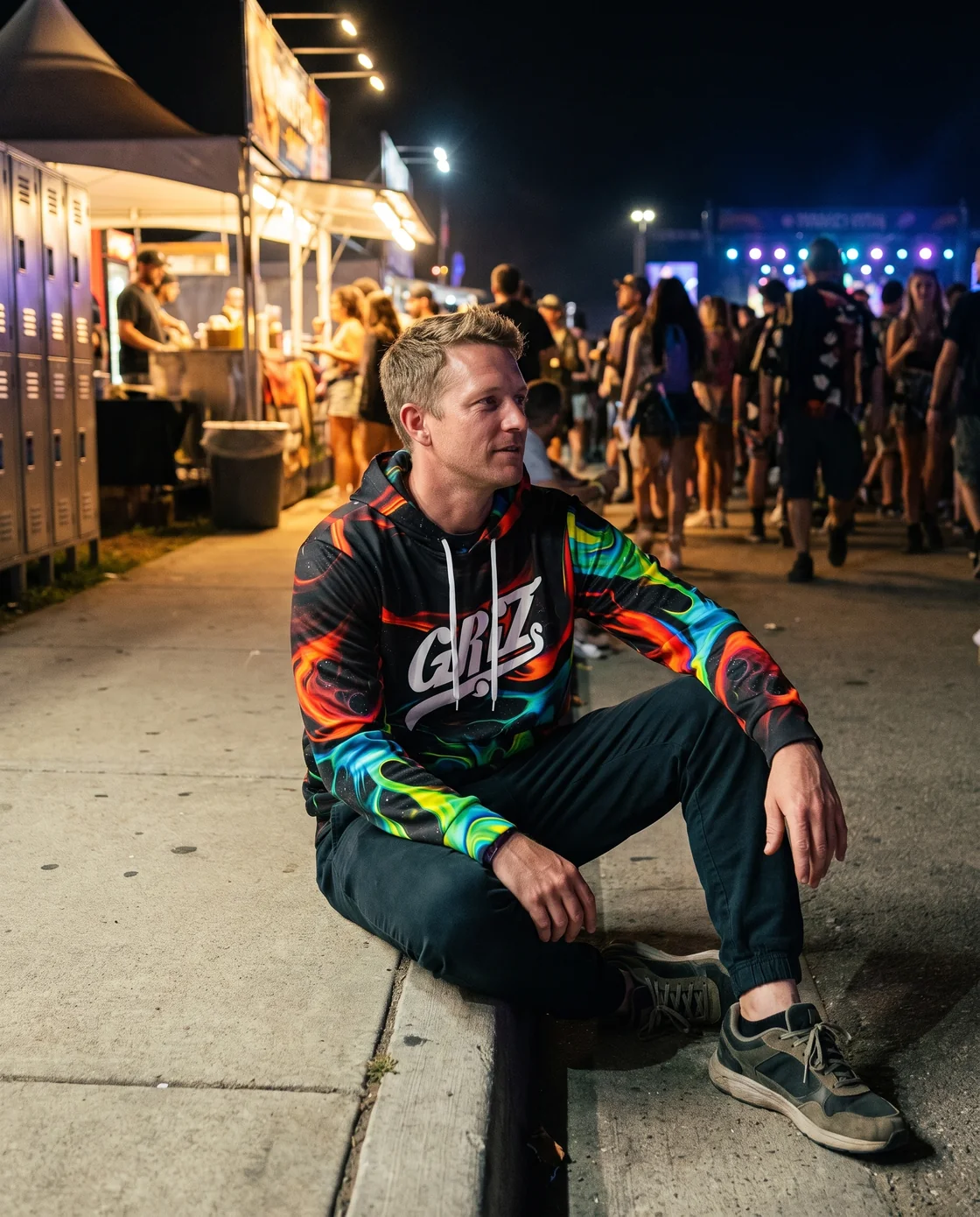 Festivalgoer wearing a printed hoodie with joggers during EDC's colder hours