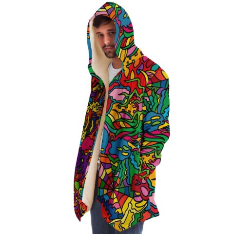 Man wearing colorful psychedelic rave cloak with sherpa-lined hood side view