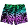 Green to purple gradient Memphis rave swim trunks with black geometric shard print, flat lay