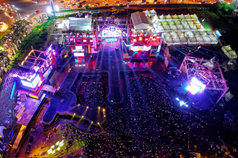 An aerial view of a rave festival at night