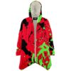 Open front view of red and green paint splatter rave cloak with cream fleece lining