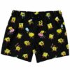 Cartoon-themed swim trunks with yellow sponge character pattern on black, front flat lay